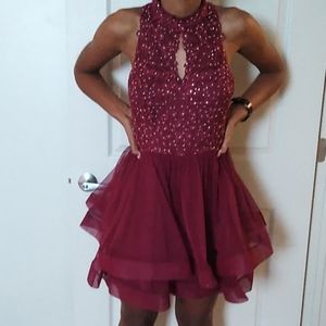 It a beautiful burgundy dress.